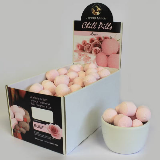 Open display box of Lumaysa passion fruit bath bomb chill pills showing multiple mini fizzers arranged for retail presentation.