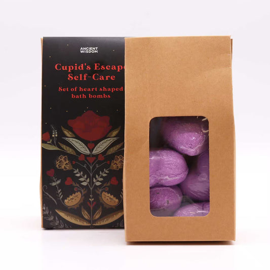 Open Lumaysa Purple Serenity bath bomb gift box showing individually wrapped purple heart-shaped lavender bath bombs inside eco-style packaging