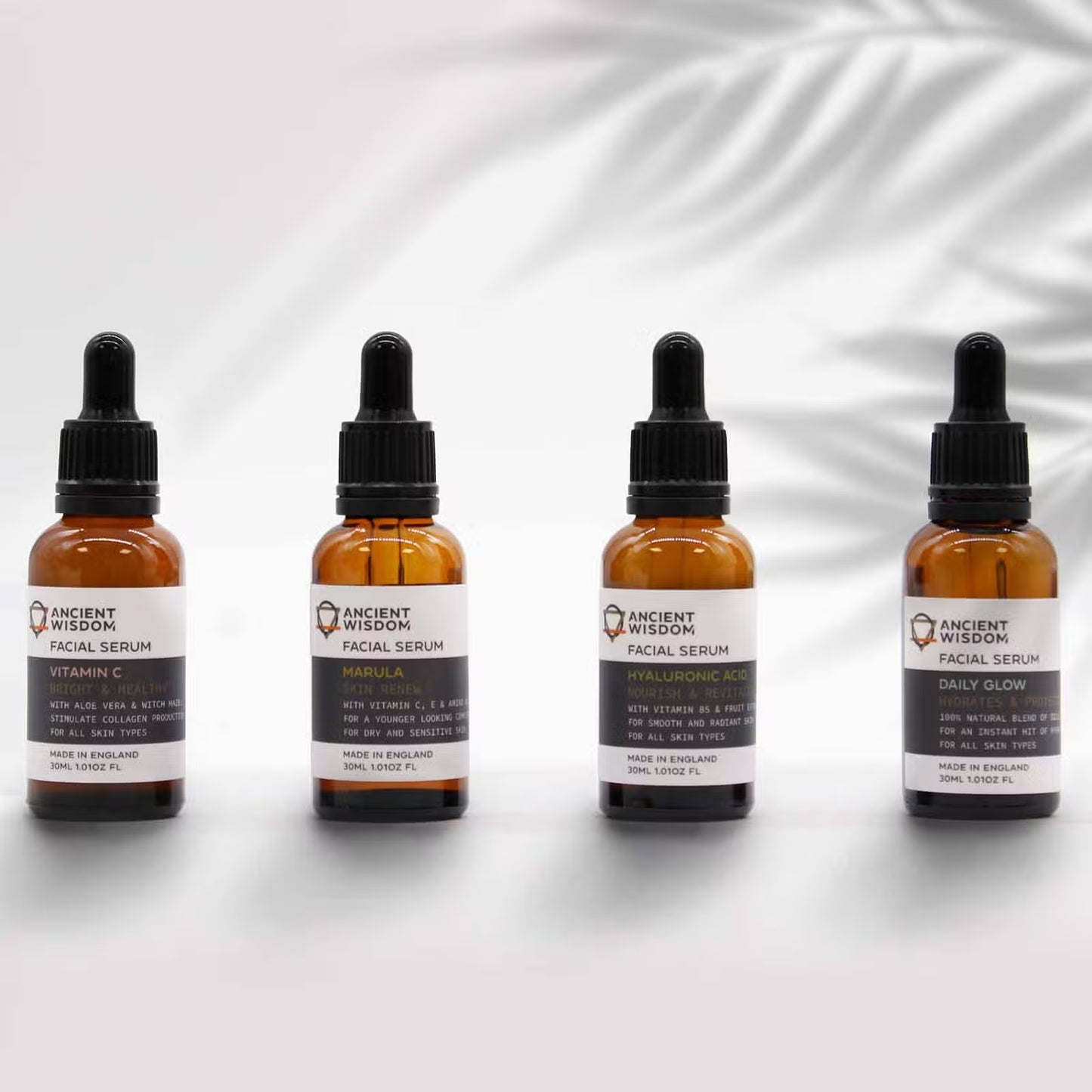 Lumaysa facial serum collection featuring Vitamin C Radiance serum in amber glass bottles, UK-made vegan skincare range