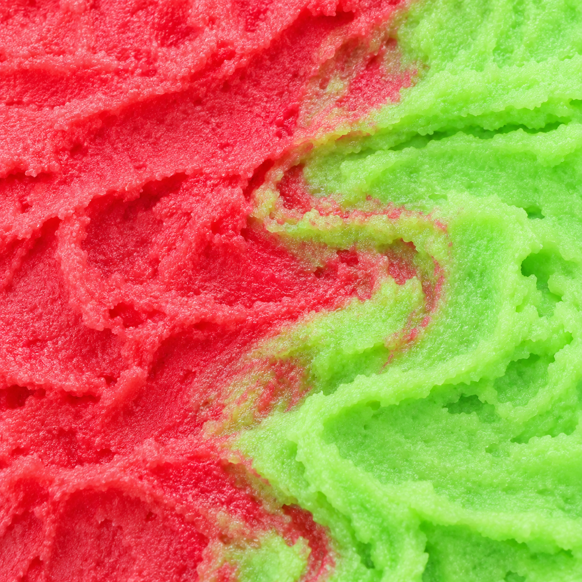Close-up of the creamy red and green texture of Strawberry & Kiwi Whipped Soap.