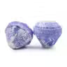 Two Lumaysa Raspberry & Pomegranate gemstone bath bombs showing jewel-cut design and blue-white swirl texture