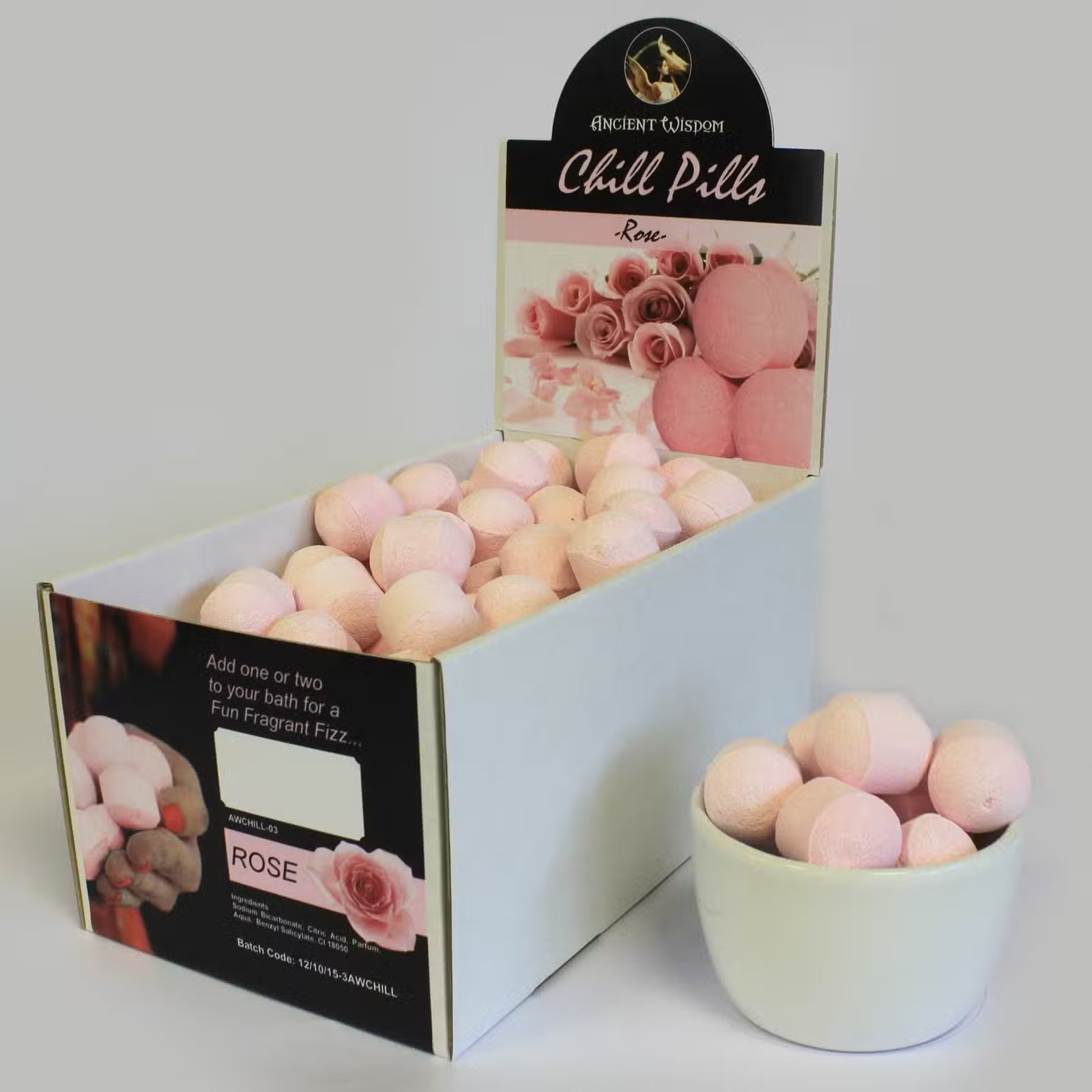 Open display box of Lumaysa passion fruit bath bomb chill pills showing multiple mini fizzers arranged for retail presentation.