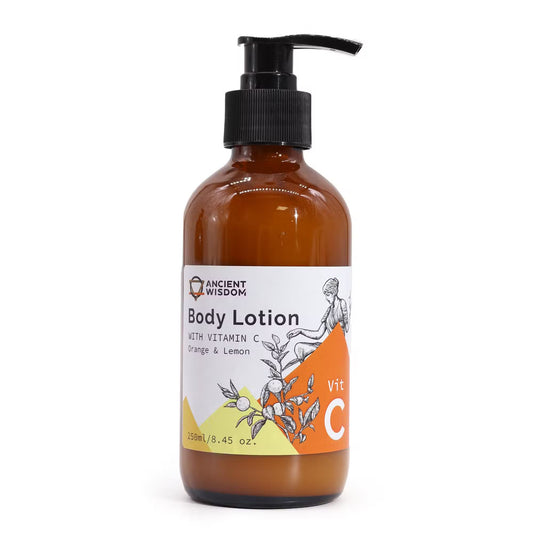 Lumaysa Citrus Glow Body Lotion Vitamin C 250ml in amber pump bottle isolated on white background, lightweight hydrating and brightening body lotion