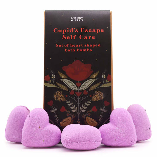 Lumaysa Purple Serenity heart bath bomb gift set with dark floral box and purple lavender heart-shaped bath bombs on a clean studio background