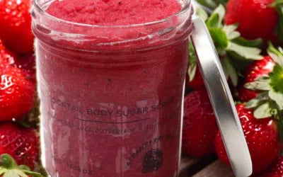 Lumaysa Berry Bliss Strawberry Rum Sugar Body Scrub – 300g jar surrounded by fresh strawberries, vibrant red exfoliating texture.