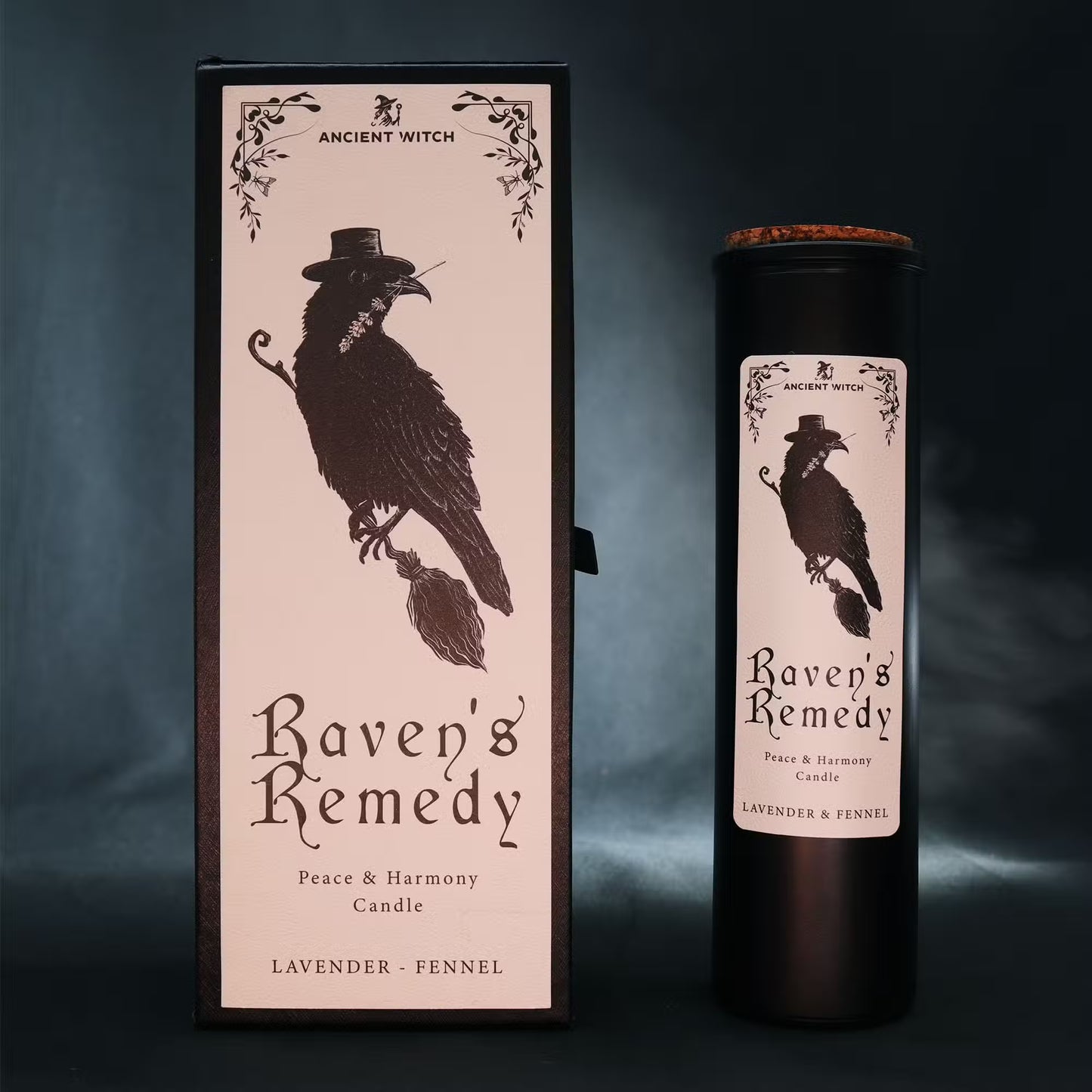 “Raven’s Remedy ritual candle with gift box – matte black tube and illustrated raven design on a dark moody background.”