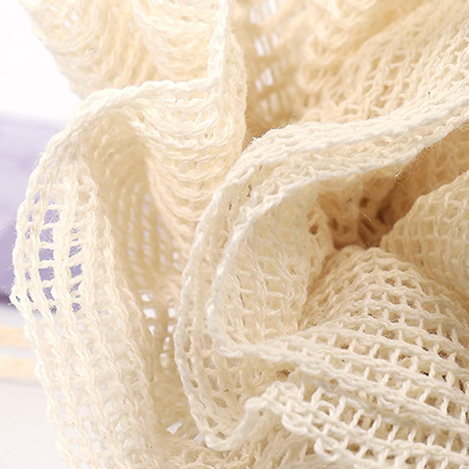 Lumaysa CloudTouch exfoliating ramie shower puff close-up showing natural ramie mesh texture