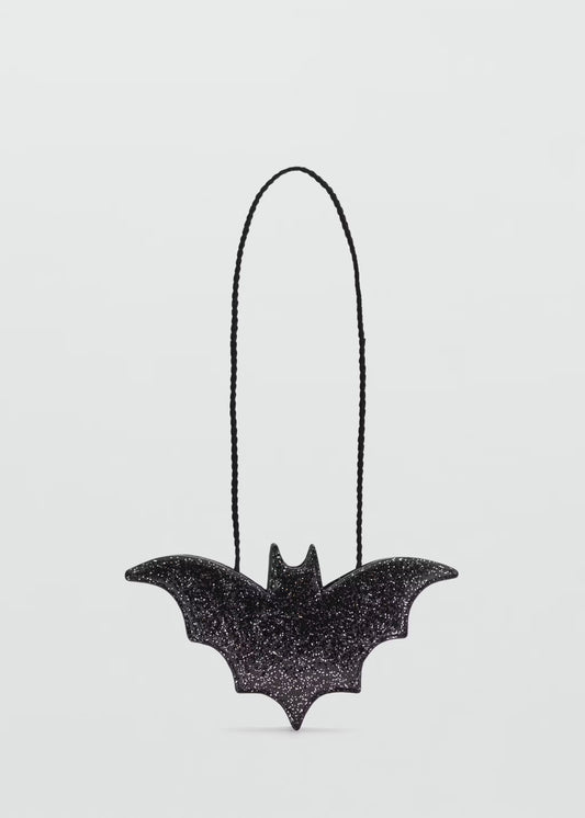 Black bat-shaped bath bomb with glitter texture on a clean white background, Lumaysa Midnight Wings luxury Halloween bath bomb