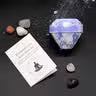 Lumaysa gemstone bath bomb with real crystals and gemstone meaning card styled for luxury self-care flat lay