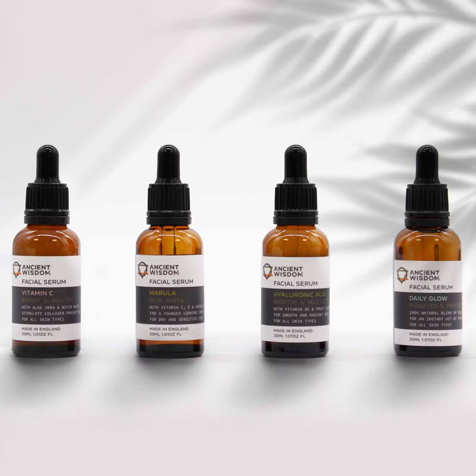Lumaysa facial serum collection featuring Vitamin C Radiance serum in amber glass bottles, UK-made vegan skincare range