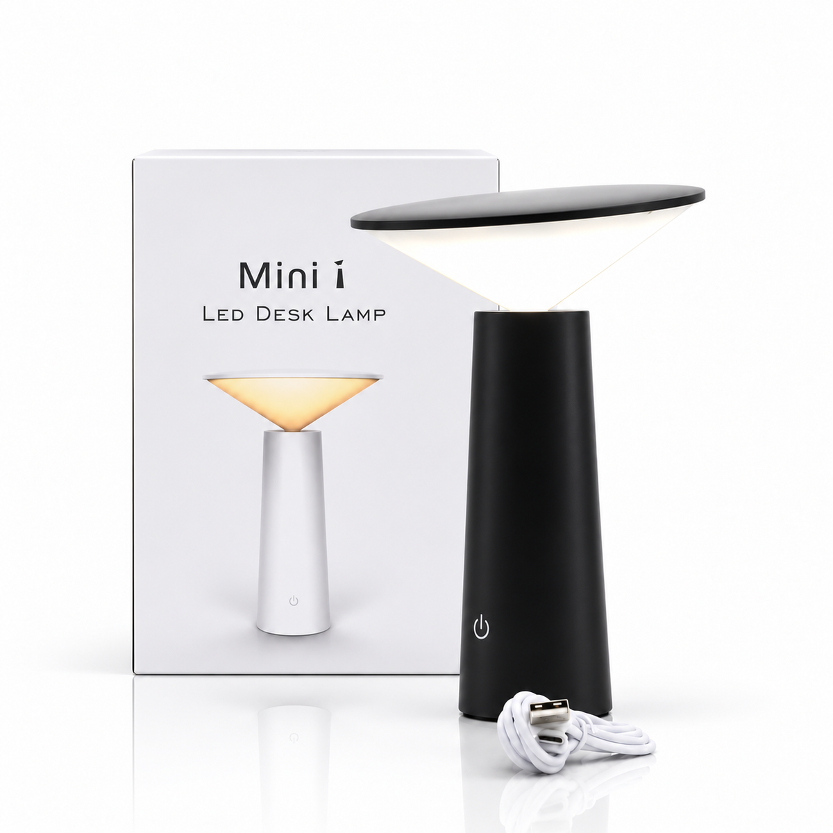 Black LED desk lamp with white packaging and USB cable, centred on a white reflective surface.