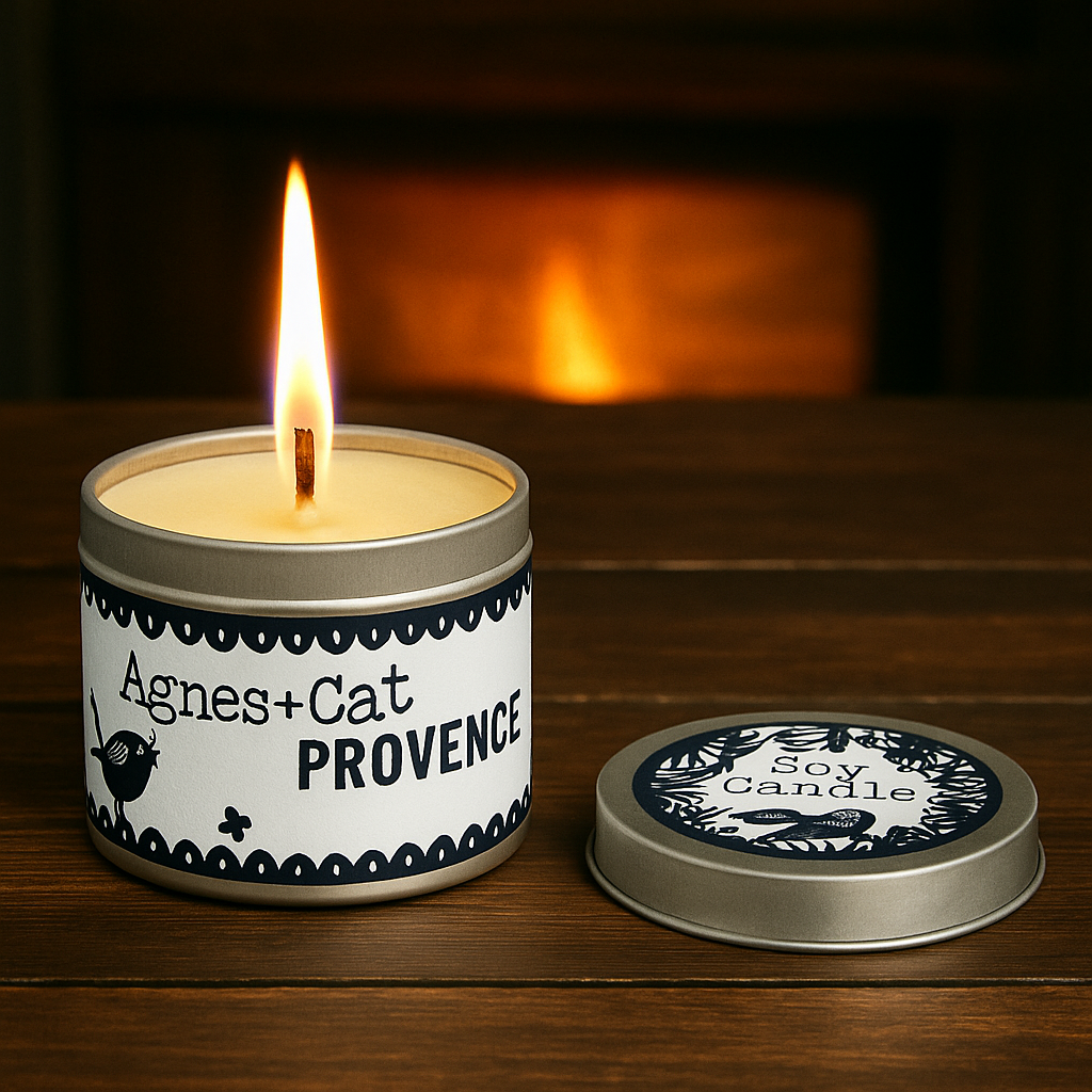 Lit Lumaysa Provence soy candle in reusable tin on wooden surface with warm ambient glow