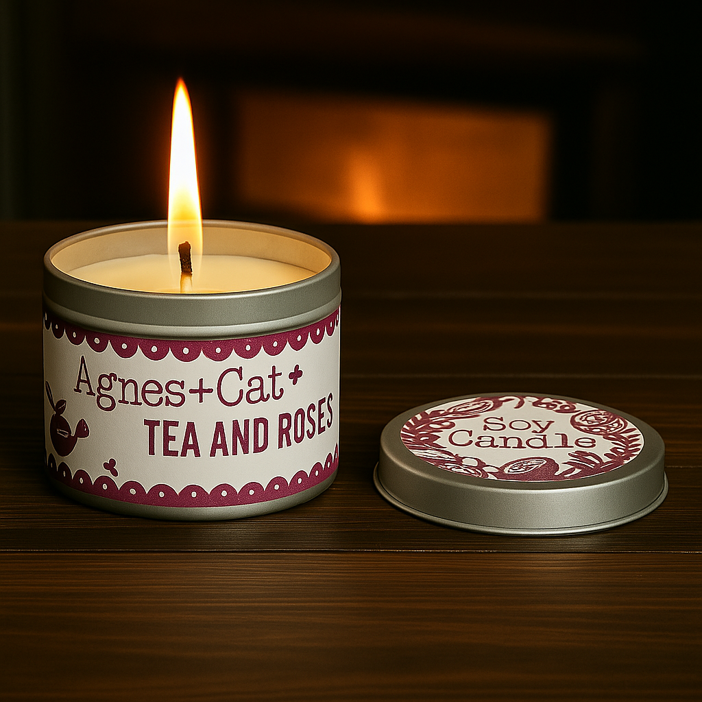 Lit Lumaysa Tea & Roses soy candle in silver tin on wooden table with lid beside it, creating a warm floral ambiance