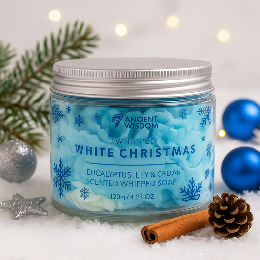 White Christmas Whipped Cream Soap by Lumaysa – festive eucalyptus, lily & cedar whipped soap jar in a winter-themed setting with pine branches and cinnamon.
