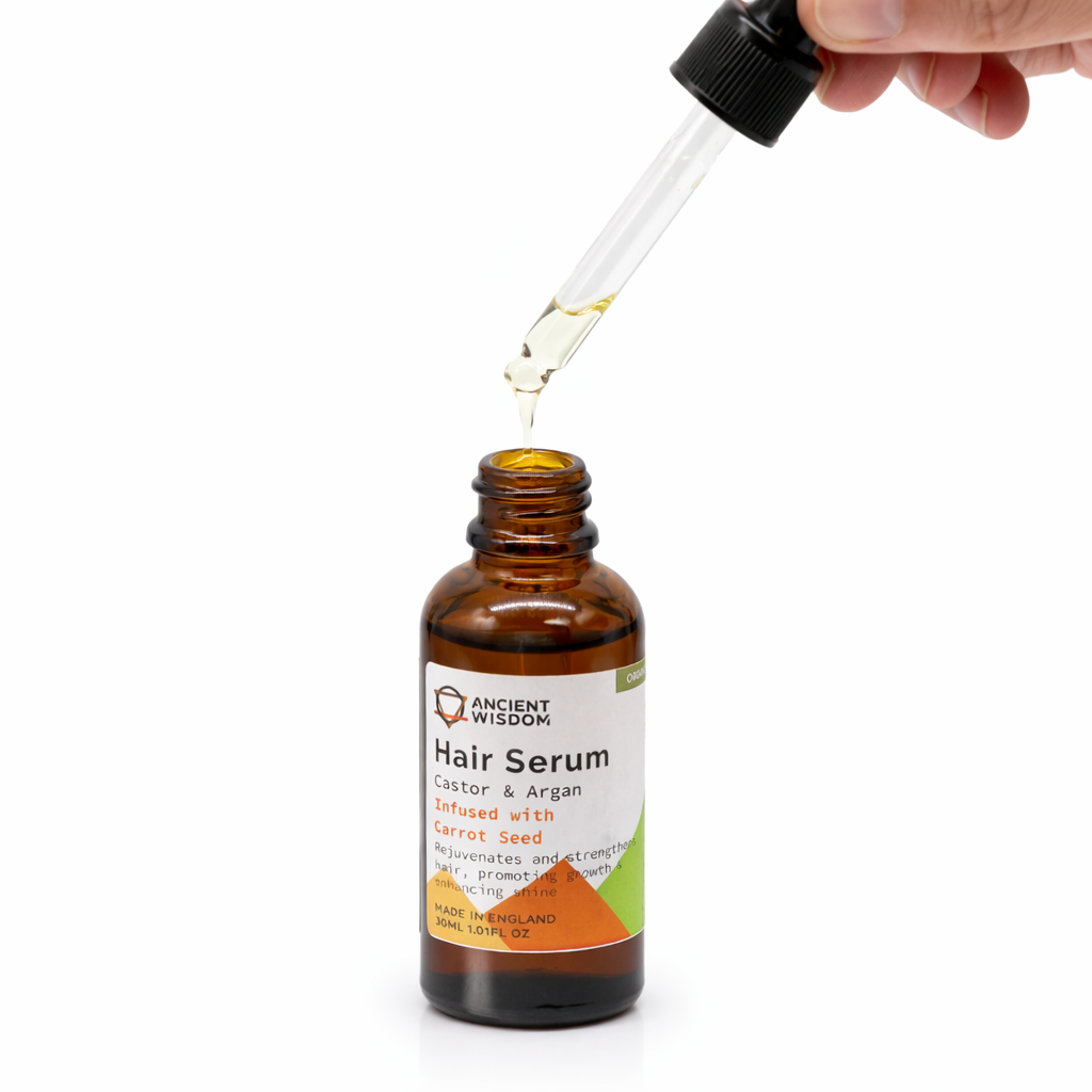 Applying Lumaysa Carrot Vitality Elixir hair serum using dropper, lightweight botanical oil for scalp care and hair protection