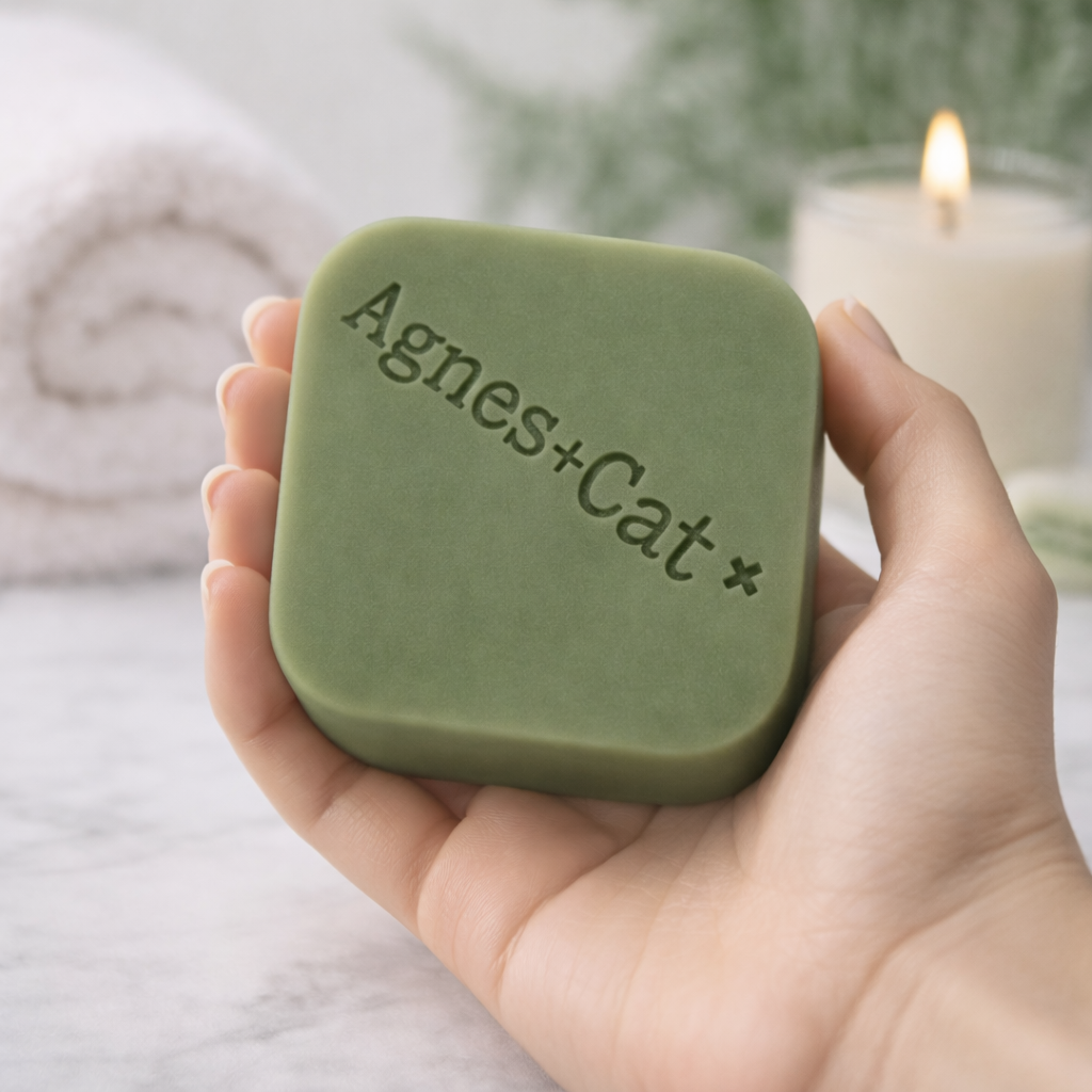 Lumaysa White Fig solid shampoo bar by Agnes + Cat held in a soft hand, spa-inspired setting with calming neutral tones
