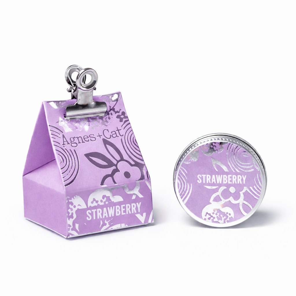 Lumaysa Strawberry Bliss vegan lip balm by Agnes & Cat with decorative gift-style packaging and metal tin, clean studio background.
