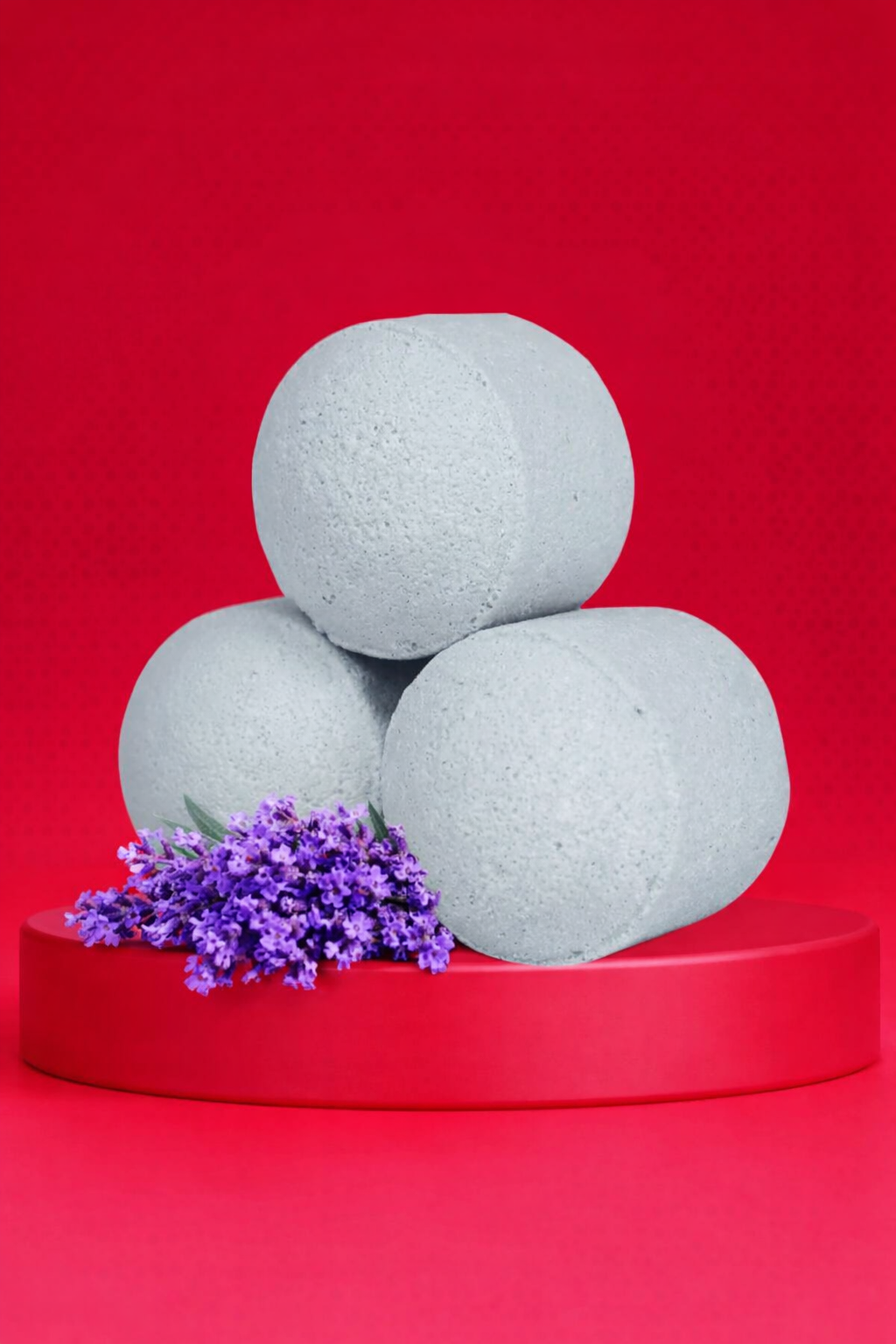 Lavender bath bomb chill pills displayed on a red pedestal with fresh lavender flowers, creating a bold premium spa aesthetic by Lumaysa.