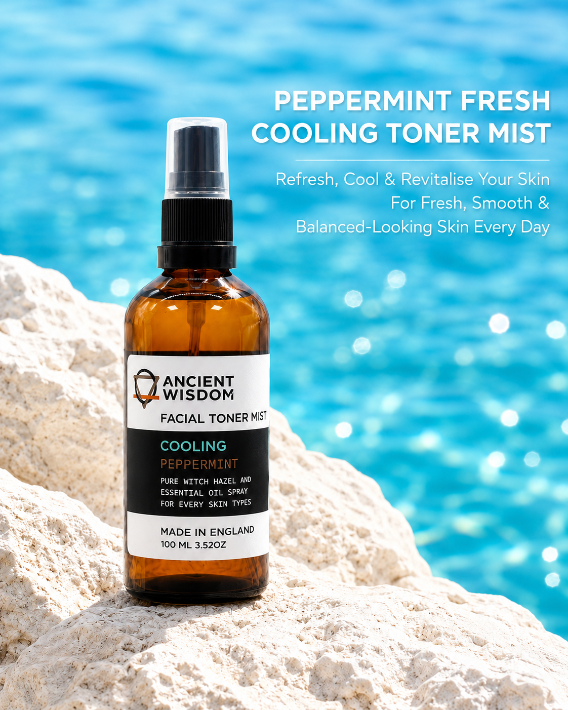 Lumaysa Peppermint Fresh Cooling Toner Mist in an amber glass spray bottle on white rocks with a blue water background, made with witch hazel and peppermint essential oil to refresh, cool, and revitalise the skin.