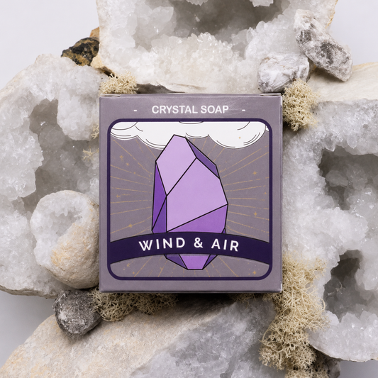 Crystal soap packaging with 'Wind & Air' branding on a rocky background