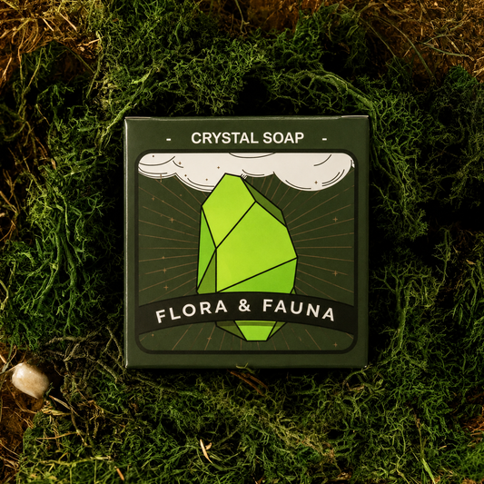 Crystal soap packaging with 'Flora & Fauna' branding on a green leafy background