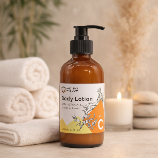 Luxury spa setting with Lumaysa Citrus Glow Body Lotion Vitamin C 250ml, surrounded by soft towels and candle for a relaxing skincare routine