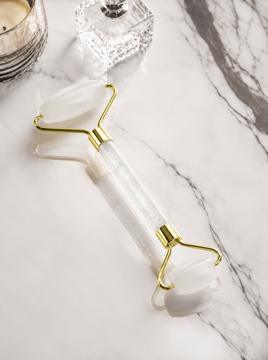 White roller with gold accents on a marble surface