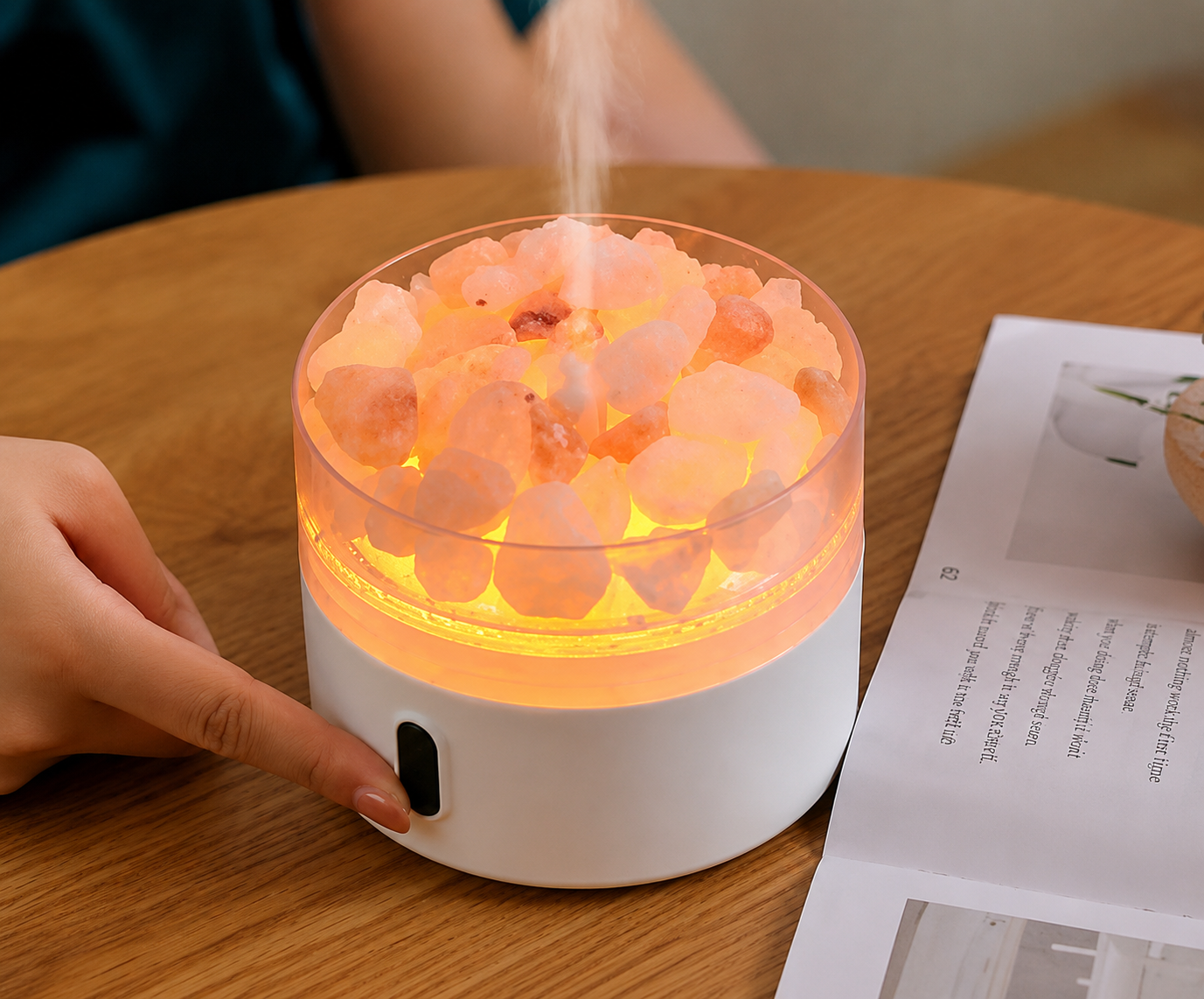 Himalayan salt lamp emitting a warm glow on a wooden table.