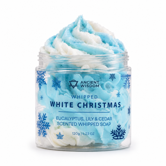 Open jar of icy blue and white White Christmas Whipped Soap with snowflake decorations and clear Ancient Wisdom branding on a white background.