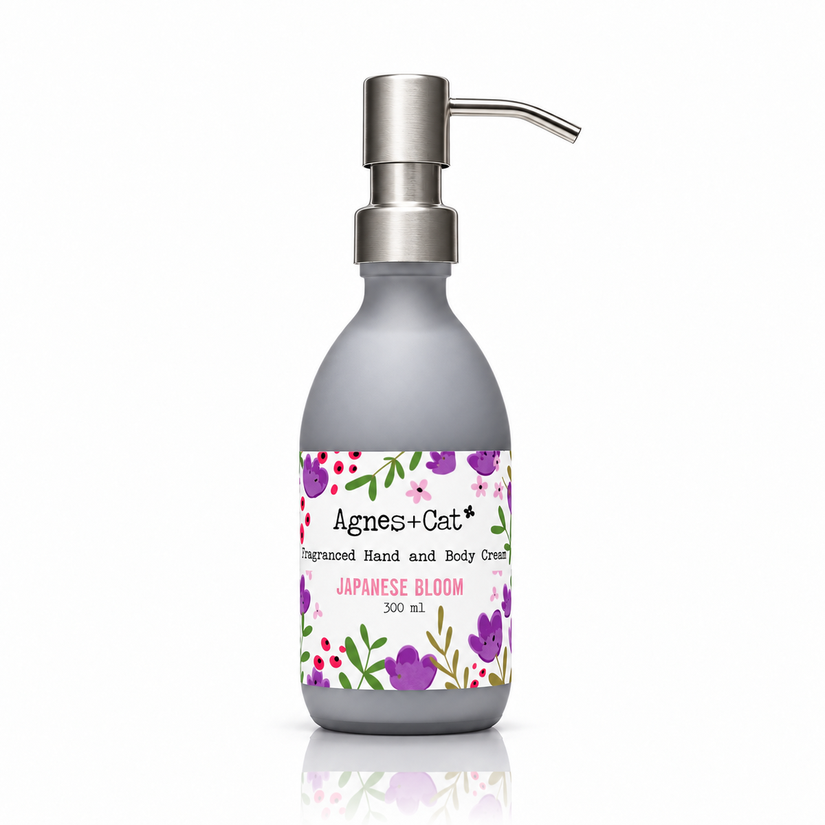 Japanese Bloom Fragranced Hand and Body Cream by Agnes + Cat in a 300ml grey pump bottle
