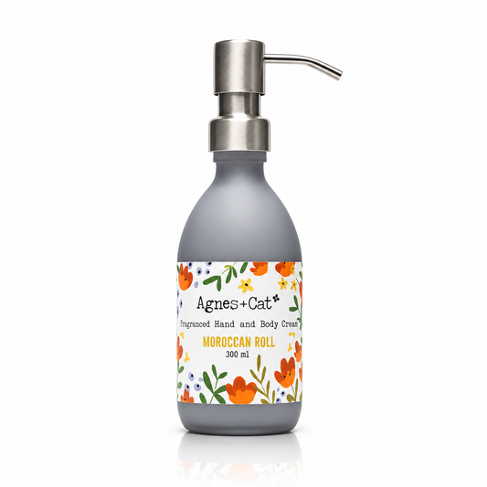 Agnes + Cat Moroccan Roll Fragranced Hand and Body Cream in a 300ml grey bottle with a silver pump