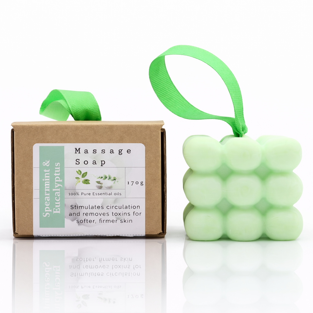 Lumaysa Peppermint & Eucalyptus massage soap bar with packaging box, green ribbon detail, and soft reflection on a minimal white background