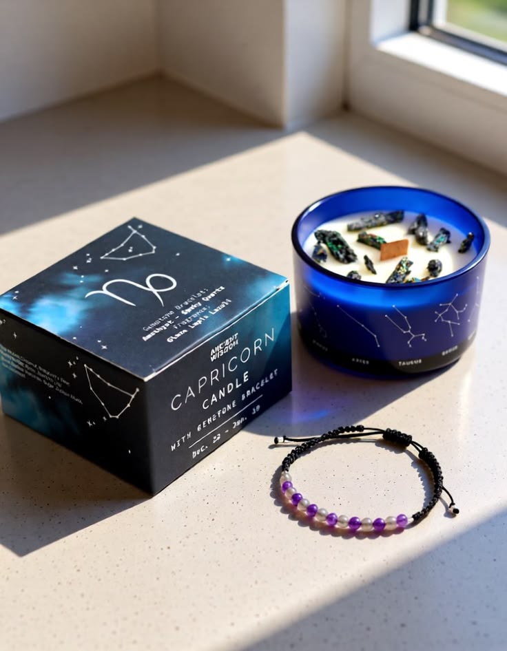 Capricorn Zodiac crystal soy candle with purple gemstone bracelet and gift box in natural sunlight