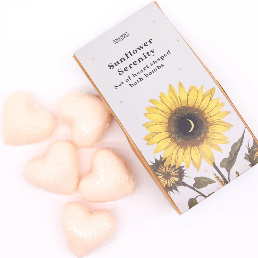 Heart-shaped passion fruit bath bombs arranged beside Lumaysa Sunflower Serenity floral gift box for a bright self-care and gifting concept