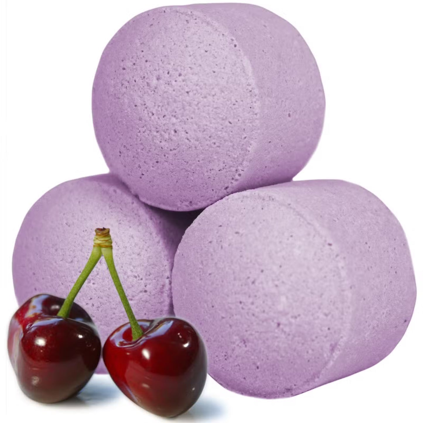 Purple black cherry bath bomb chill pills stacked with fresh cherries on a clean white background, Lumaysa Indulgent Escape.