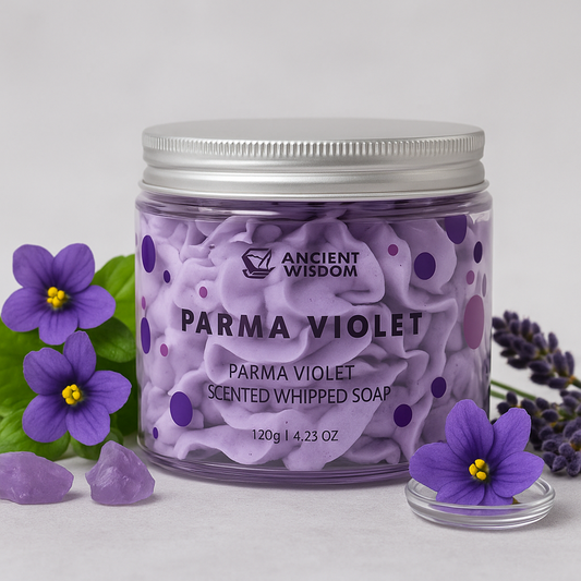 Lumaysa Parma Violet Whipped Cream Soap surrounded by violet flowers – luxury vegan whipped soap with calming floral scent