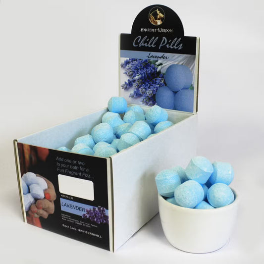 Open display box of Lumaysa lavender bath bomb chill pills showing multiple mini fizzers arranged for retail presentation.