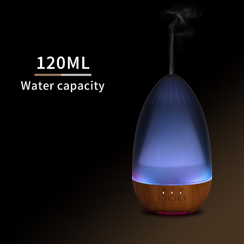 Lumaysa Serenity Glow ultrasonic aroma diffuser releasing aromatic mist, 120ml water capacity, with ambient LED lighting on dark background