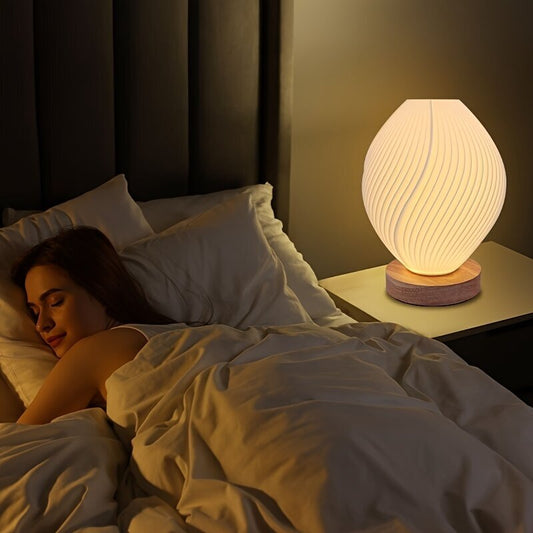 Lumaysa Shell Flow sculpted ambient table lamp with a shell-inspired design, perfect for stylish home lighting.