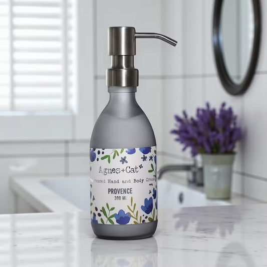 Lumaysa Lavender Provence Hand & Body Lotion (300ml) in a matte grey pump bottle, styled in a modern bathroom with soft lavender accents for a calming self-care aesthetic.