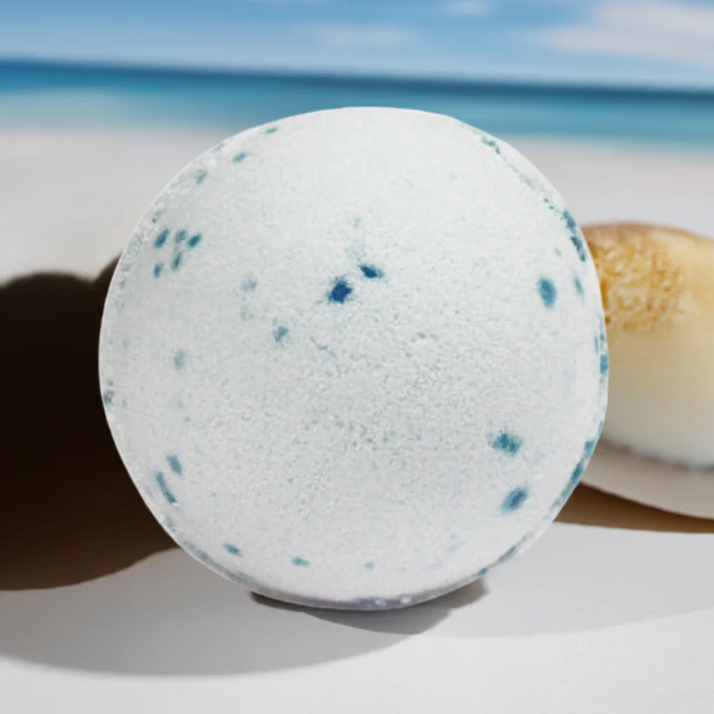 Close-up of Lumaysa Ocean Breeze bath bomb with ocean-inspired texture and blue mineral speckles, luxury spa bath aesthetic for refreshing relaxation
