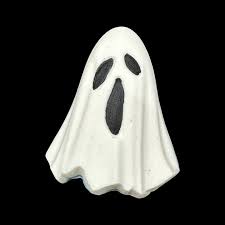 White ghost bath bomb on black background, spooky Halloween bath product with minimal aesthetic