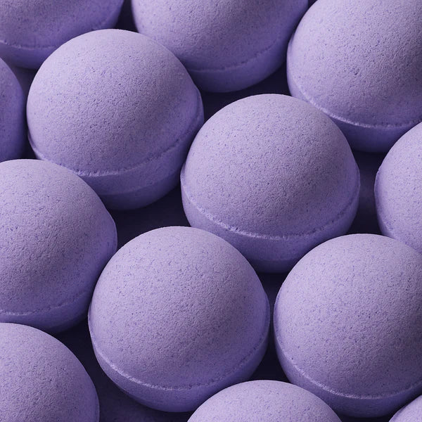 Multiple Lumaysa Midnight Calm lavender bath bombs arranged together, soft purple colour representing calming aromatherapy spa experience