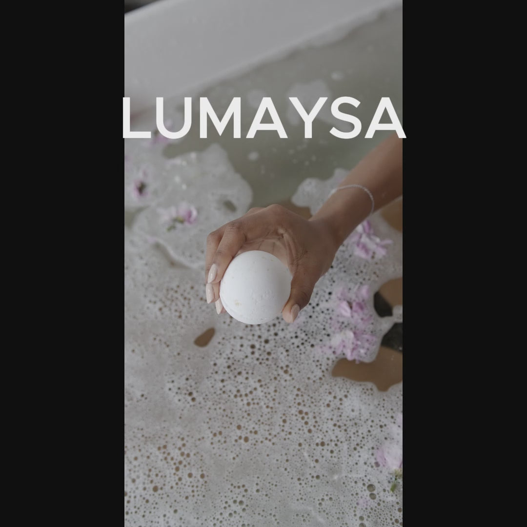 Rainbow bath bomb fizzing in water with colorful effects