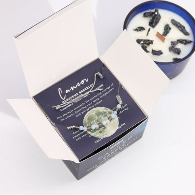 Lumaysa Cancer crystal soy candle gift set with gemstone bracelet displayed in open luxury zodiac box