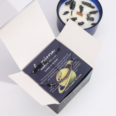 Open Lumaysa Zodiac Harmony Capricorn candle gift box showing crystal soy wax candle and gemstone bracelet inside